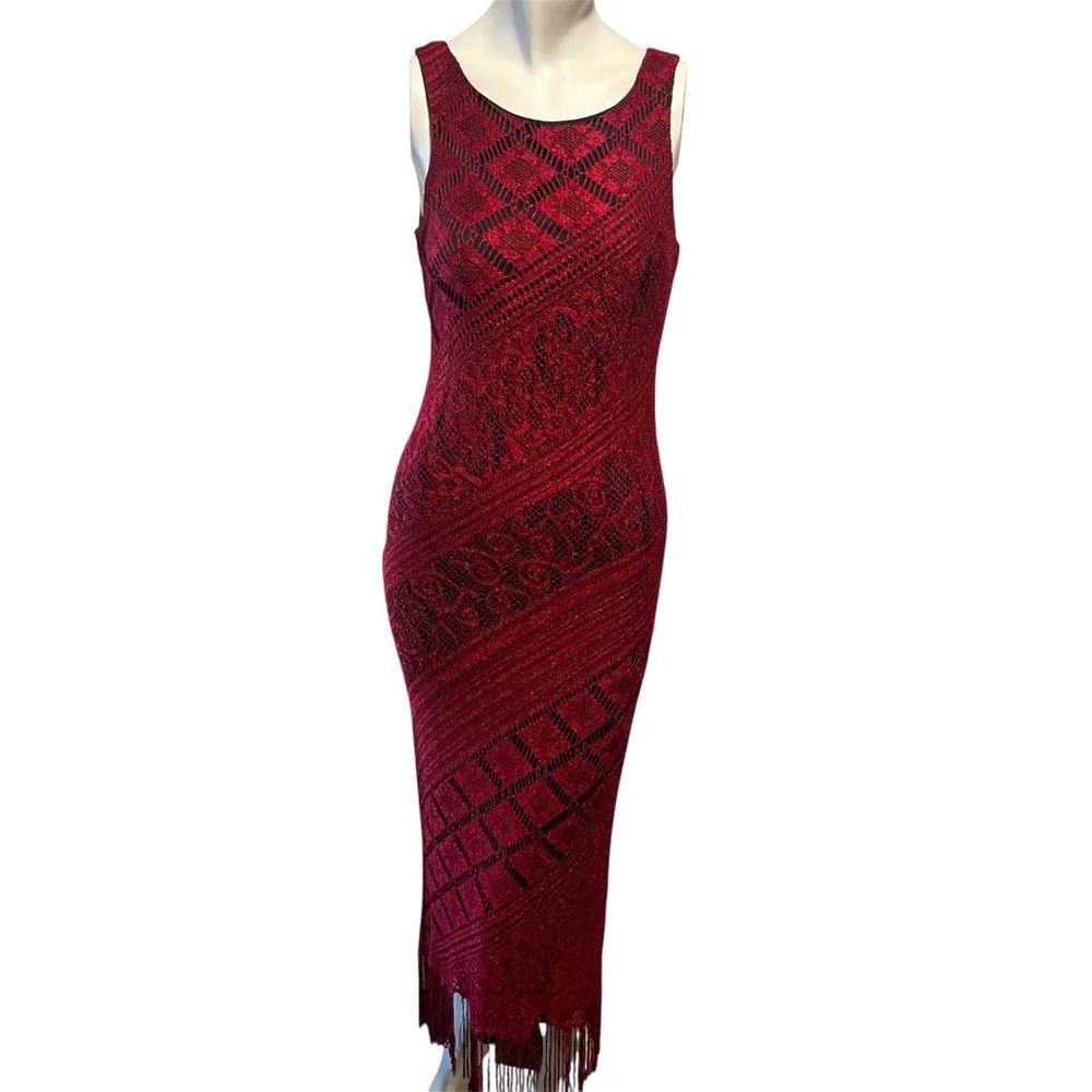 Vintage-inspired sleeveless midi dress with fringe hem
